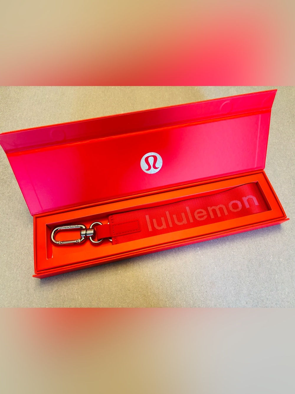 Lululemon Collective Pinnacle Red “Never Lost” Keychain